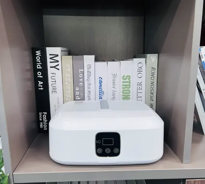 Customer photo shared by Marina: the AirdrobeX unit stored on a bookshelf