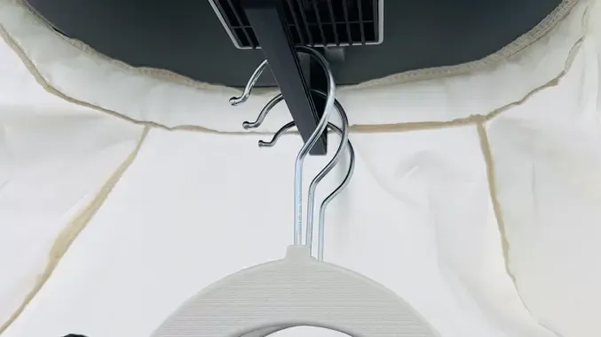 Customer photo shared by Michael: a clothes hanger hooked inside the AirdrobeX drying cover