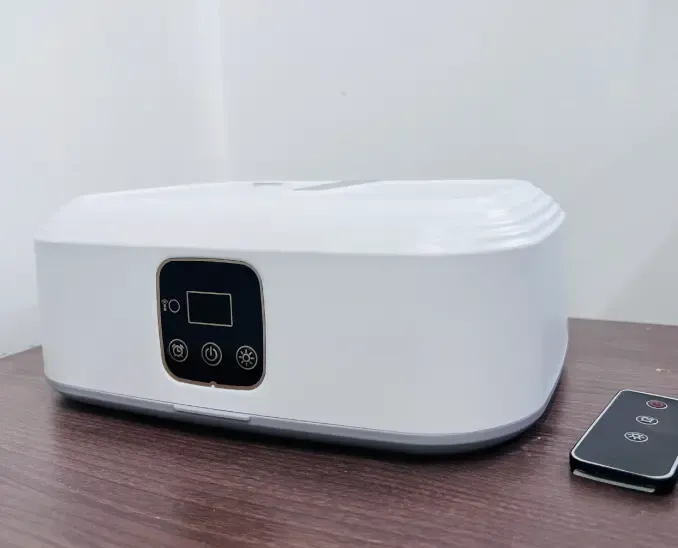 Qinux AirdrobeX unit and remote control on a table as received by a customer